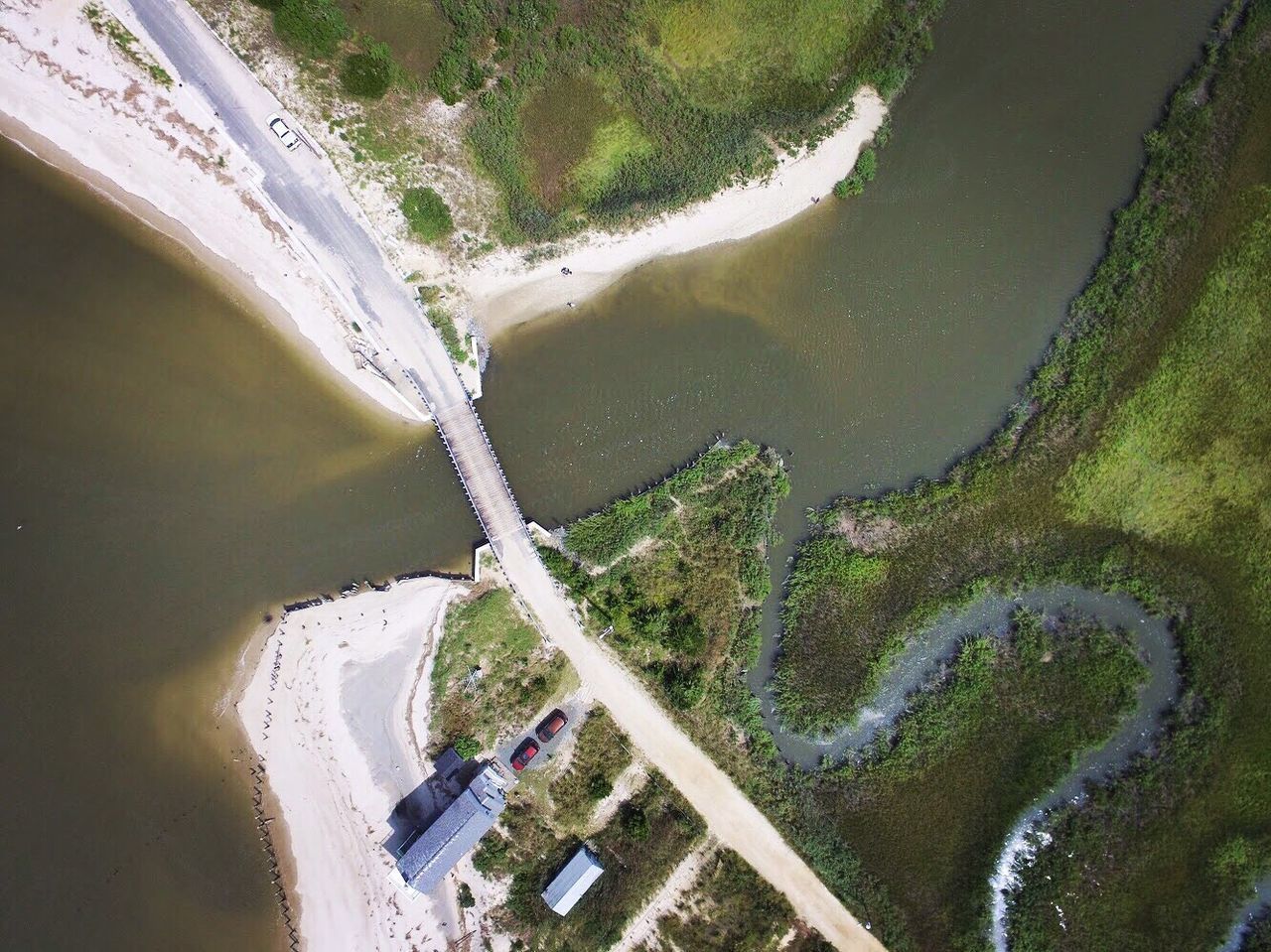 HIGH ANGLE VIEW OF ROAD BY RIVER