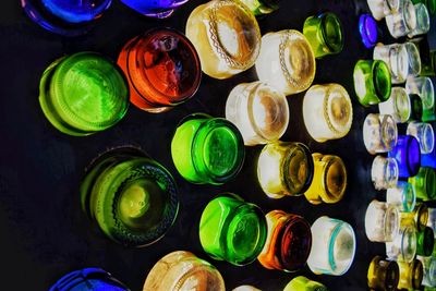 High angle view of multi colored bottles