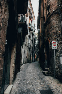 Road amidst buildings in city