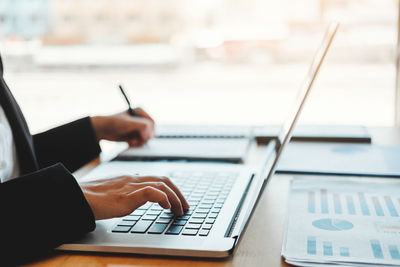 Man using laptop on table