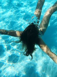 High angle view of man swimming in sea