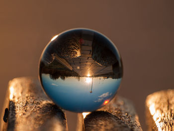 Close-up of crystal ball on wood