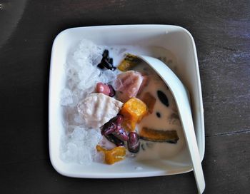 High angle view of iced dessert served in plate on table