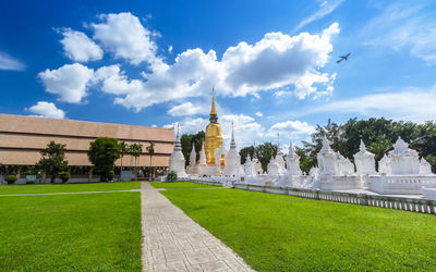 View of temple building against cloudy sky