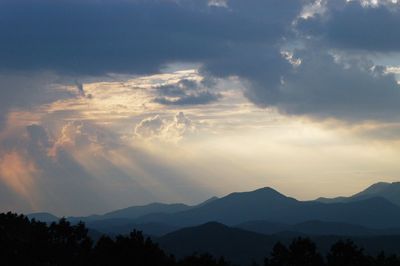 Scenic view of silhouette mountains against sky