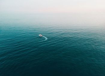 High angle view of people in sea against sky