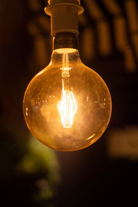 Close-up of illuminated light bulb