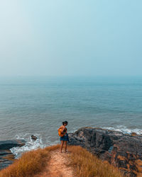 Goan girl enjoying the seascape on a beach