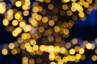 Defocused image of illuminated lights at night