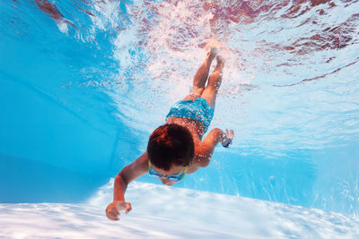 Carefree by diving in swimming pool