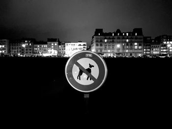 Close-up of illuminated city against sky at night