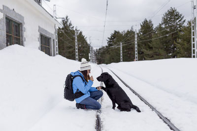 Dog on snow covered field