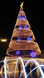 Low angle view of illuminated lights at night