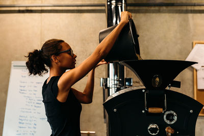 Young woman working in workshop