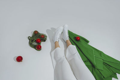 Teenage girl with abstract christmas tree over white background