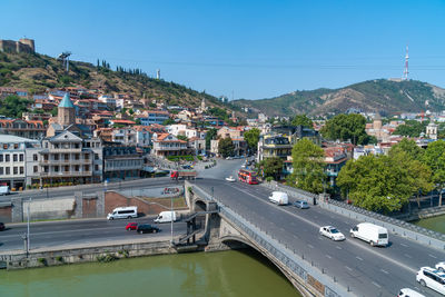 High angle view of city by road against sky