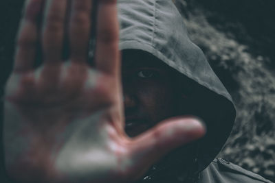 Close-up of human hand holding leaf