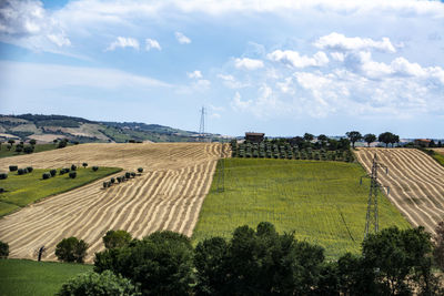 Panoramic shot of agricultural field against sky