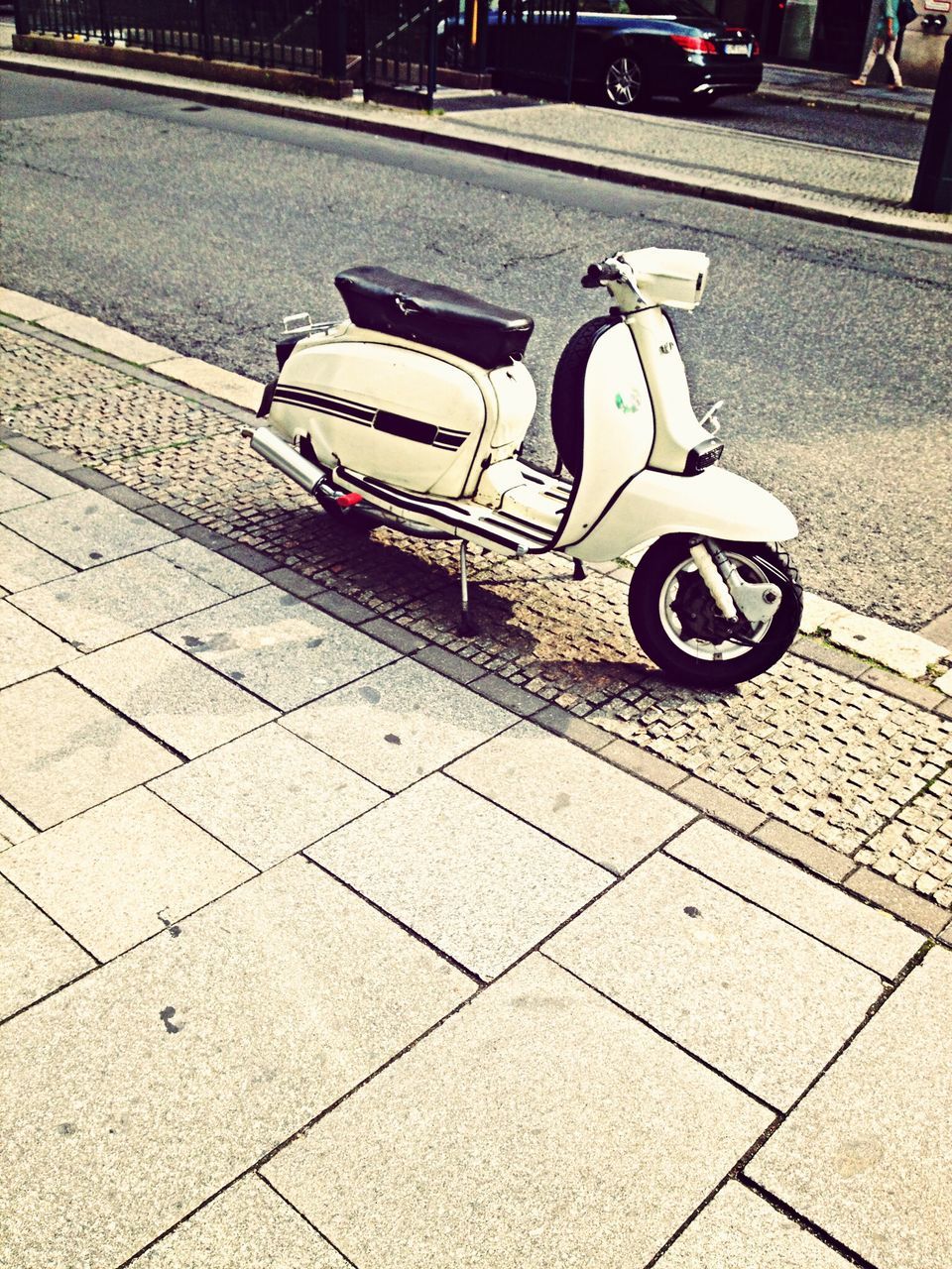 transportation, street, road marking, land vehicle, mode of transport, road, car, high angle view, asphalt, cobblestone, the way forward, outdoors, empty, paving stone, sidewalk, stationary, parking lot, parking, travel, communication