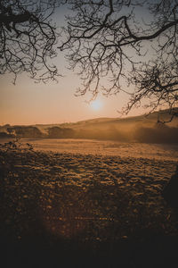 Scenic view of landscape against sky during sunset