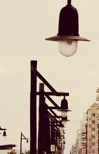 Low angle view of street light against sky