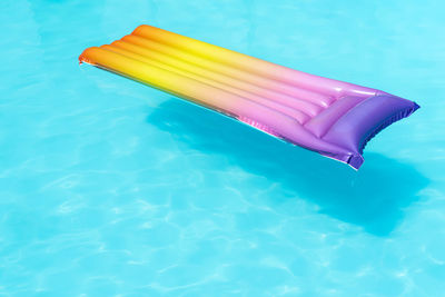 High angle view of inflatable raft over swimming pool