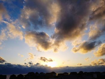 Low angle view of dramatic sky during sunset