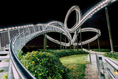 View of bridge in city at night