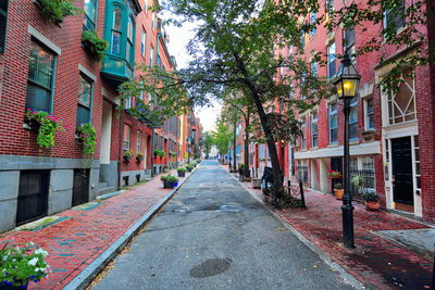 Narrow street amidst buildings in city