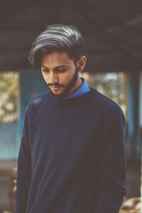 Young man standing outdoors