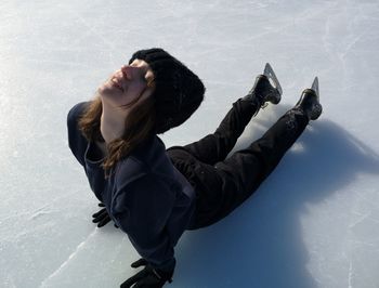 Side view of a young woman in water