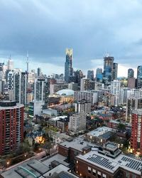 High angle view of buildings in city against sky