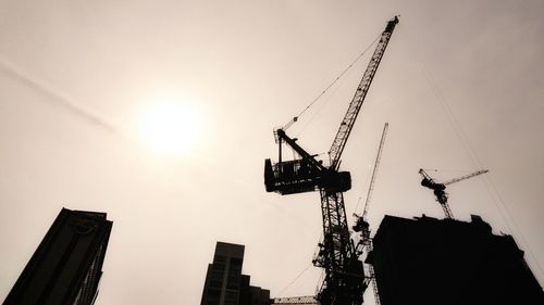 Low angle view of crane at construction site