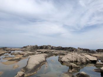 Scenic view of rocks against sky