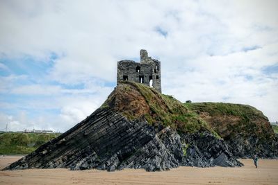 View of old ruin building against cloudy sky