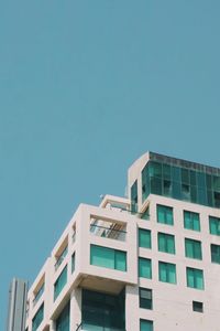 Low angle view of building against clear blue sky