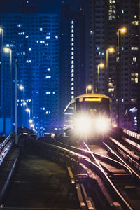 Illuminated buildings in city at night