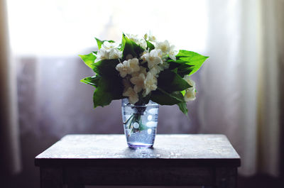 Close-up of flower vase on table