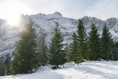 Scenic view of snow covered mountains against sky