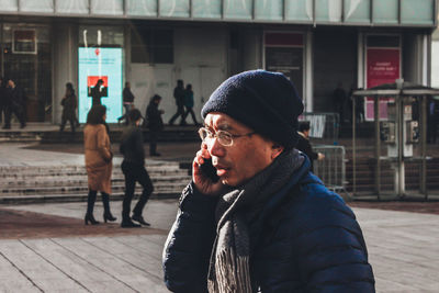Man using phone outdoors