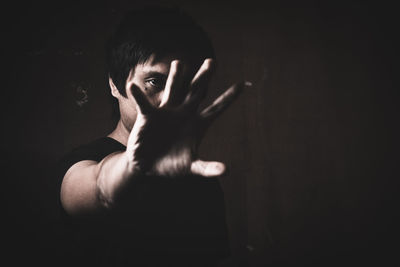 Portrait of mid adult woman in darkroom