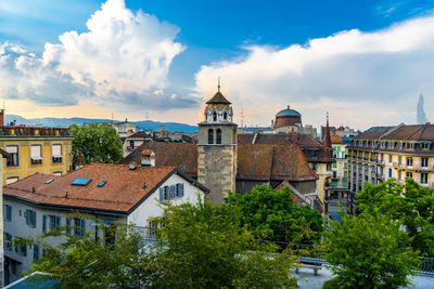 Panoramic view of buildings in city against sky