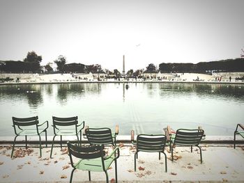 Empty bench at seaside