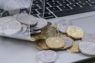 High angle view of coins on table