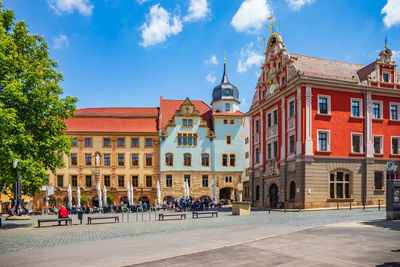 Group of people in front of buildings in town