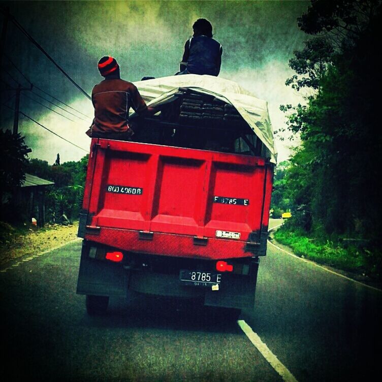 red, transportation, mode of transport, land vehicle, car, travel, on the move, road, men, technology, public transportation, outdoors, day, rear view, auto post production filter, street, railroad track, motion