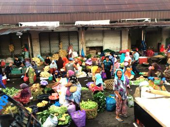 Group of people at market stall