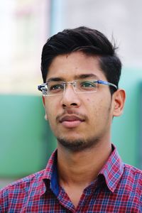 Close-up portrait of young man looking away