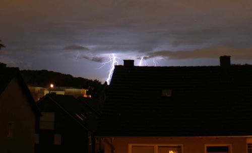 Low angle view of building against cloudy sky