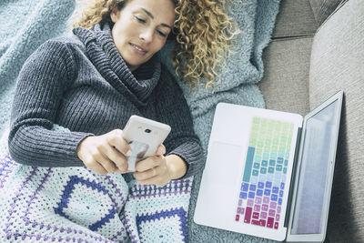 Midsection of woman using mobile phone